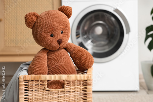 Wicker basket with toy bear...