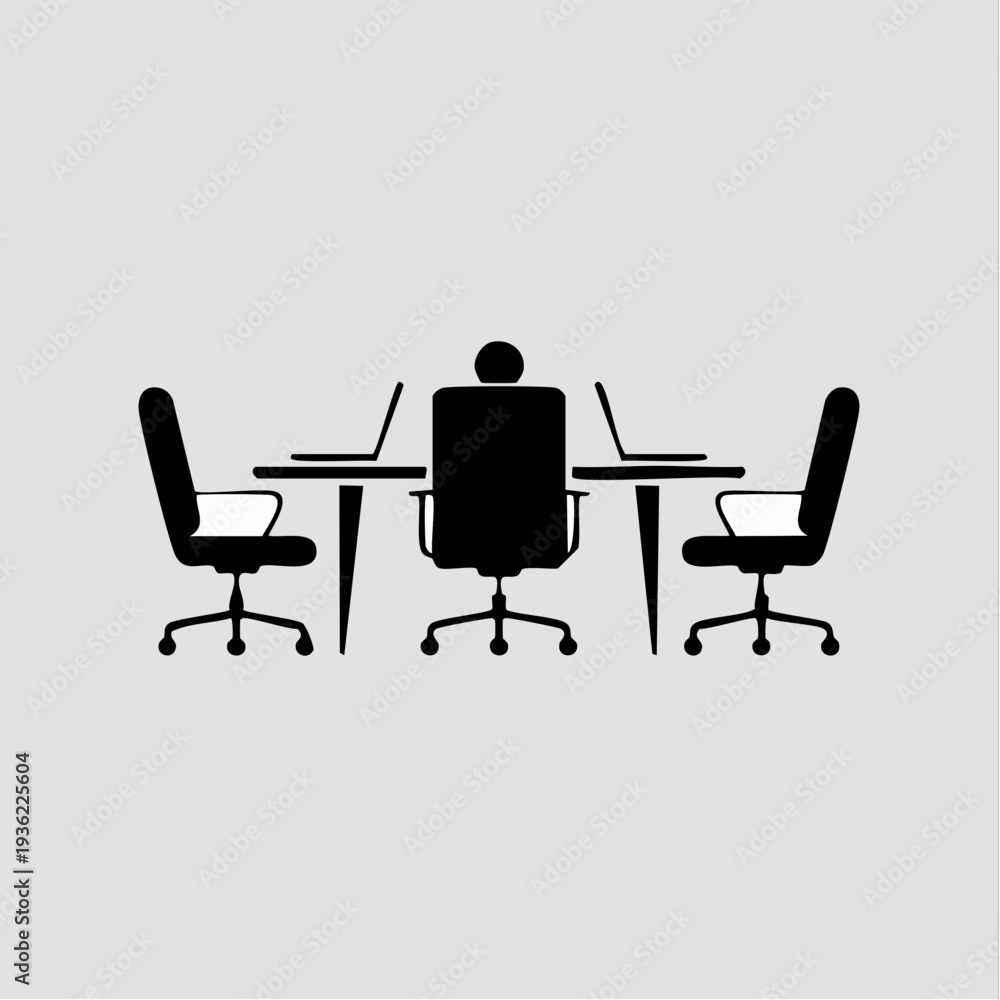 Fototapeta premium Silhouette of a person sitting at a conference table with laptops.