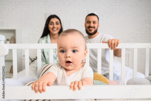 Happy young family and cute...