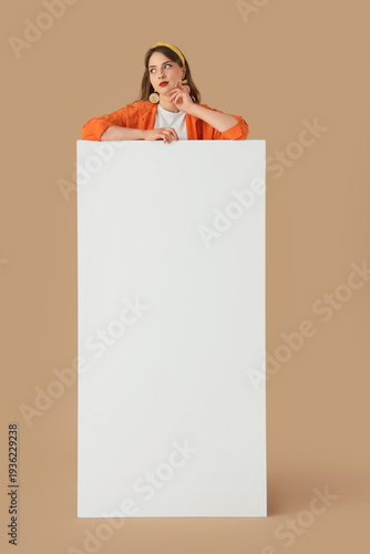 Thoughtful young woman with...