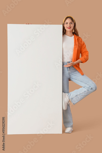 Young woman with blank post...