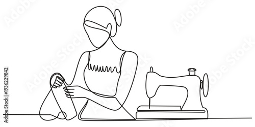A woman is sitting next to a sewing machine