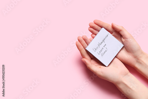 Female hands holding paper ...