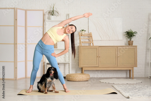 Sporty young woman with her...