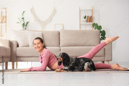 Sporty young woman with dog...
