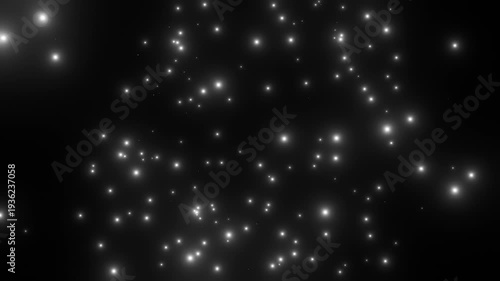 黒背景の上に浮かぶたくさんの白い粒子
