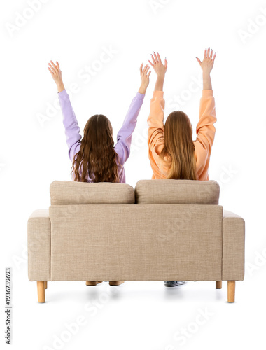 Happy young women sitting o...