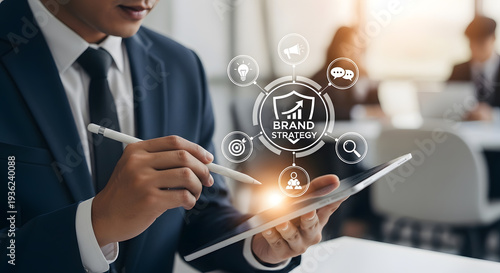 Businessman Using Stylus Pen on Digital Tablet to Analyze Brand Strategy and Marketing Plan