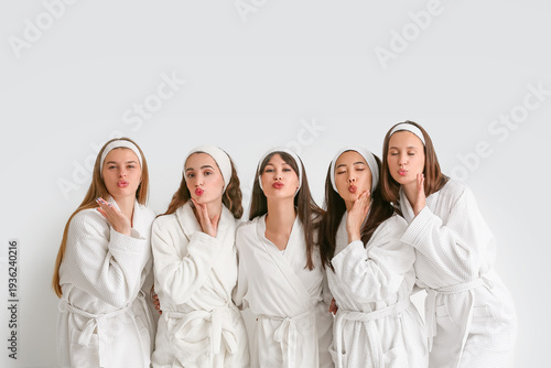 Group of young women in bat...
