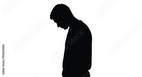 Silhouette of a person with head lowered expressing sadness or contemplation