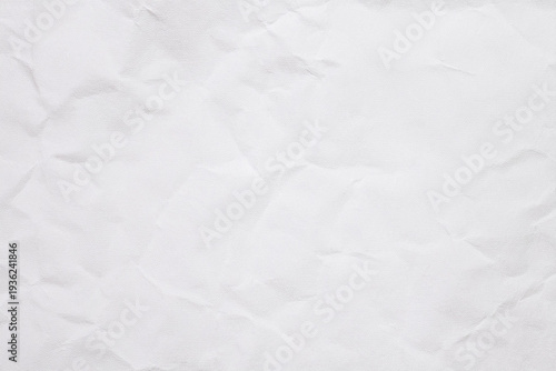 Crumpled White recycled craft paper texture as background.