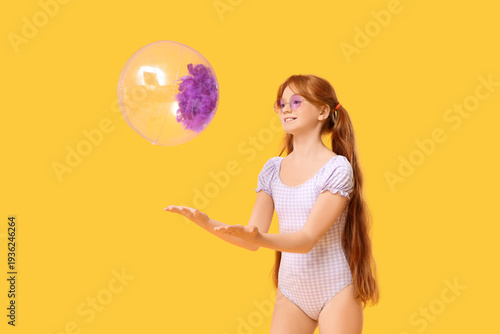 Little redhead girl with be...