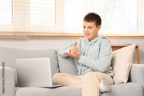 Mute boy using sign languag...
