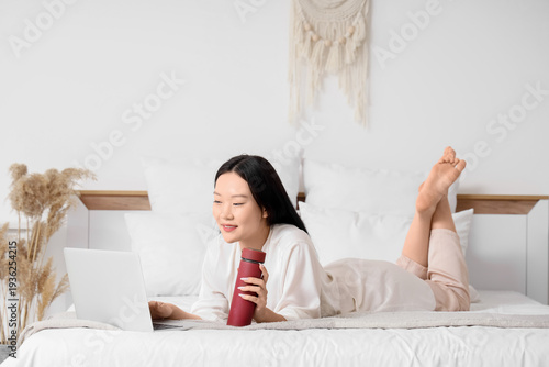 Young Asian woman with ther...