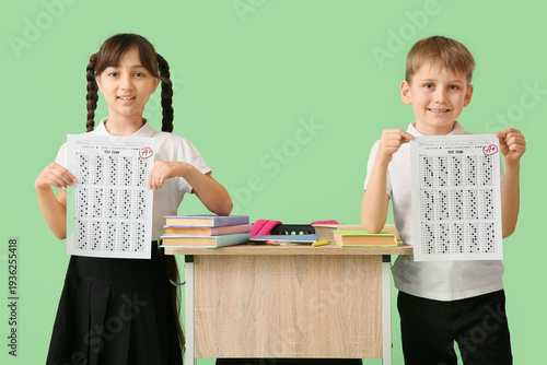 Happy little pupils with bo...