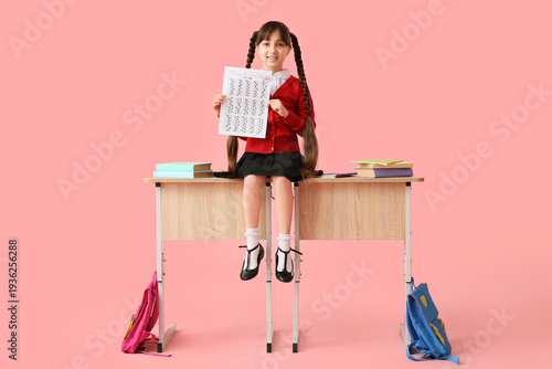Happy schoolgirl with books...