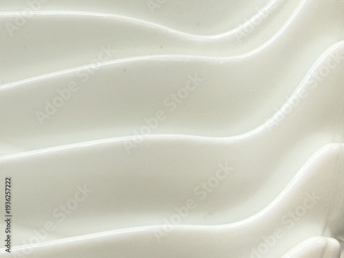 A white surface with a series of waves