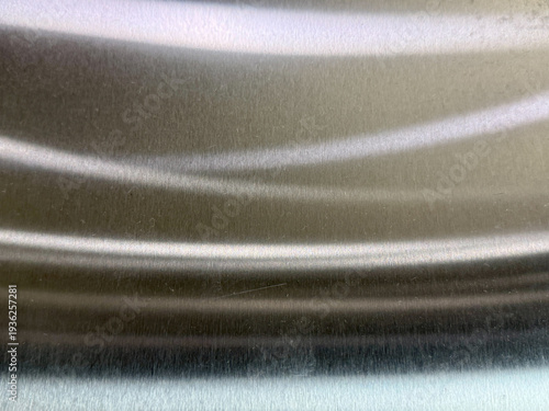 A silver surface with a wavy texture