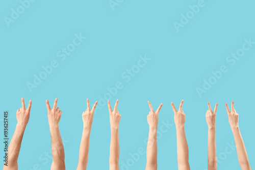 Many hands showing victory ...