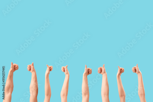Many hands showing thumbs-u...