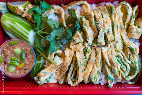 Wallpaper Mural Thai omelette with acacia leaves served with shrimp paste sauce on rice in red lunch box Torontodigital.ca