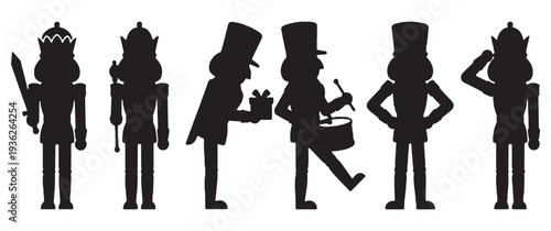 Collection of black silhouette nutcracker figures in various poses, including holding a sword, a scepter, a gift, playing a drum, and saluting.