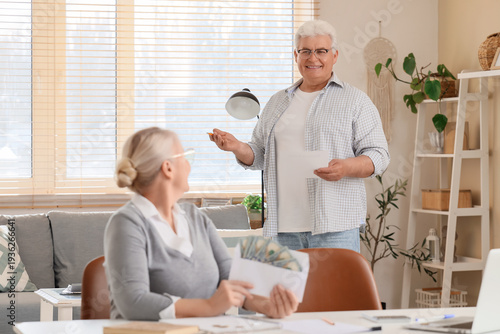 Senior man with refund form...