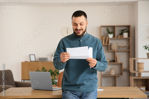 Young man with refund form ...