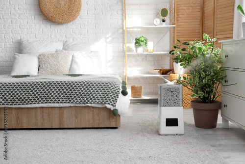 Modern humidifier on floor ...