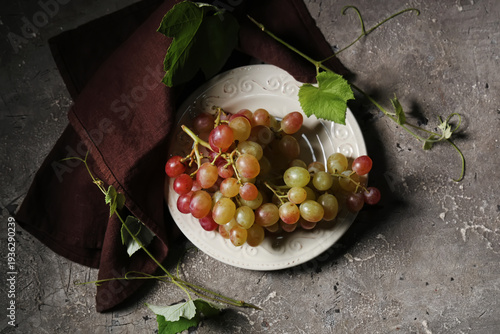 Plate with sweet ripe grape...