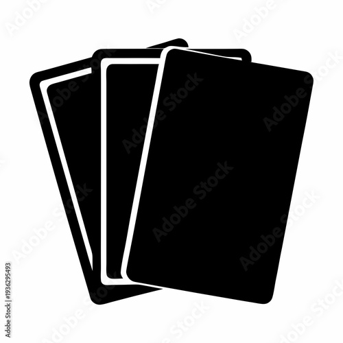Three playing cards in a stack, ready for a game of poker