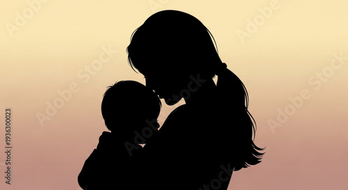 Silhouette of mother holding baby at sunset with warm gradient background