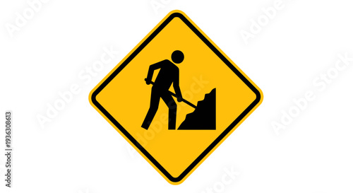 A construction worker shovels on a road sign indicating maintenance work ahead.