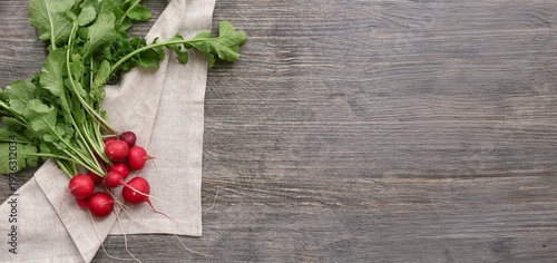Fresh radish on wooden background with space for text, top view