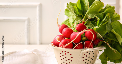 Colander with fresh radish ...