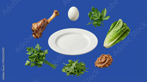 Wallpaper Mural Passover seder plate with symbolic foods arranged on blue background. Roasted shank bone, hard boiled egg, fresh parsley, bitter lettuce and charoset. Jewish holiday tradition for family celebration Torontodigital.ca
