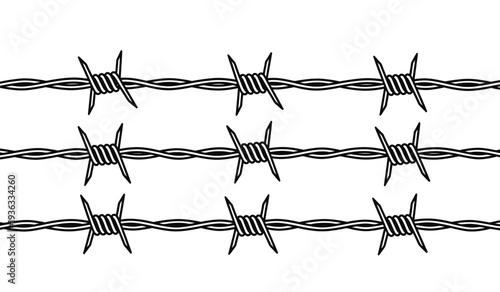 Barbed wire fence with sharp metal spikes on isolated for security or boundary concepts