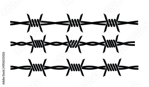 Barbed wire fence with sharp twisted metal strands on for security or boundary concepts
