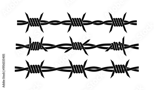 Barbed wire fence with sharp thorns and twisted metal strands for security or boundary concepts