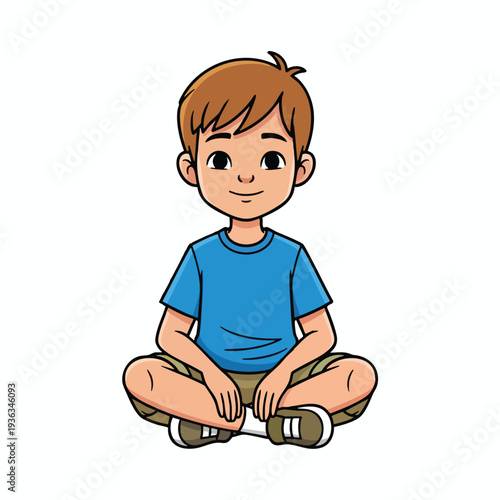 Cute Young Boy Sitting Cross Legged on the Floor in a Casual Outfit