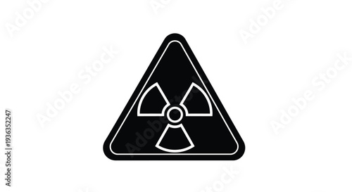 Black triangular sign displaying a white radiation warning symbol