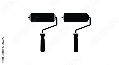 Two black paint rollers isolated on a white background