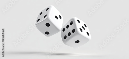 Two white dice are suspended mid-air against a blurred light gray background