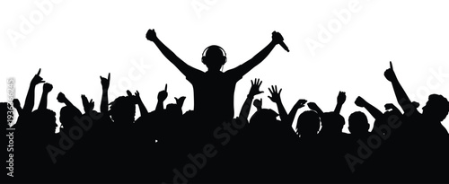 Silhouette of a dj with raised hands and a cheering concert crowd