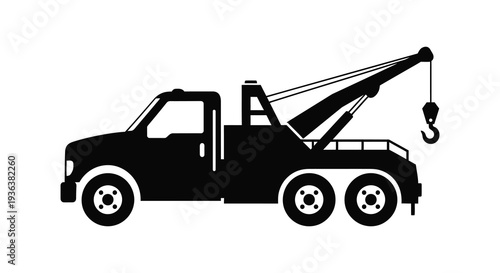 A stark black silhouette of a tow truck with a raised boom and hook capturing roadside assistance