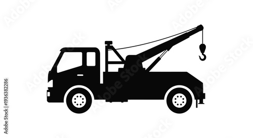 A stark black silhouette of a tow truck with a lifting hook showcasing its industrial design silhouette