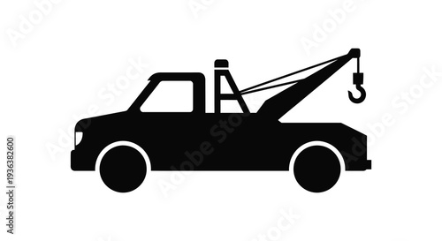 A stark black silhouette depicts a tow truck with a raised crane showcasing roadside assistance silhouette high quality