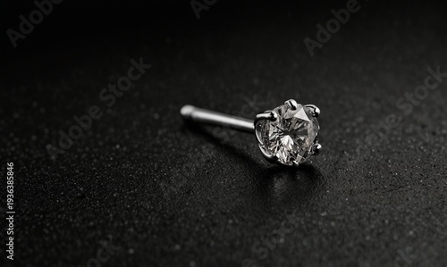 Solitaire diamond nose stud with minimalist modern finish on black background