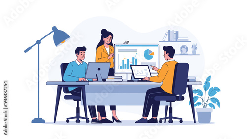 Colleagues working together at a large desk with multiple computer monitors while analyzing financial graphs and business data in an office.