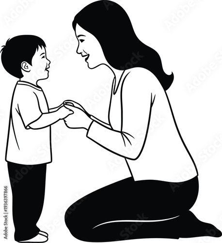 A woman kneeling down and holding hands with a young boy in a white shirt and black pants on a plain